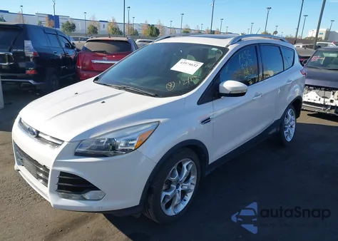 2014 Ford Escape Titanium z USA, uszkodzony, nr VIN 1FMCU9J92EUB16573